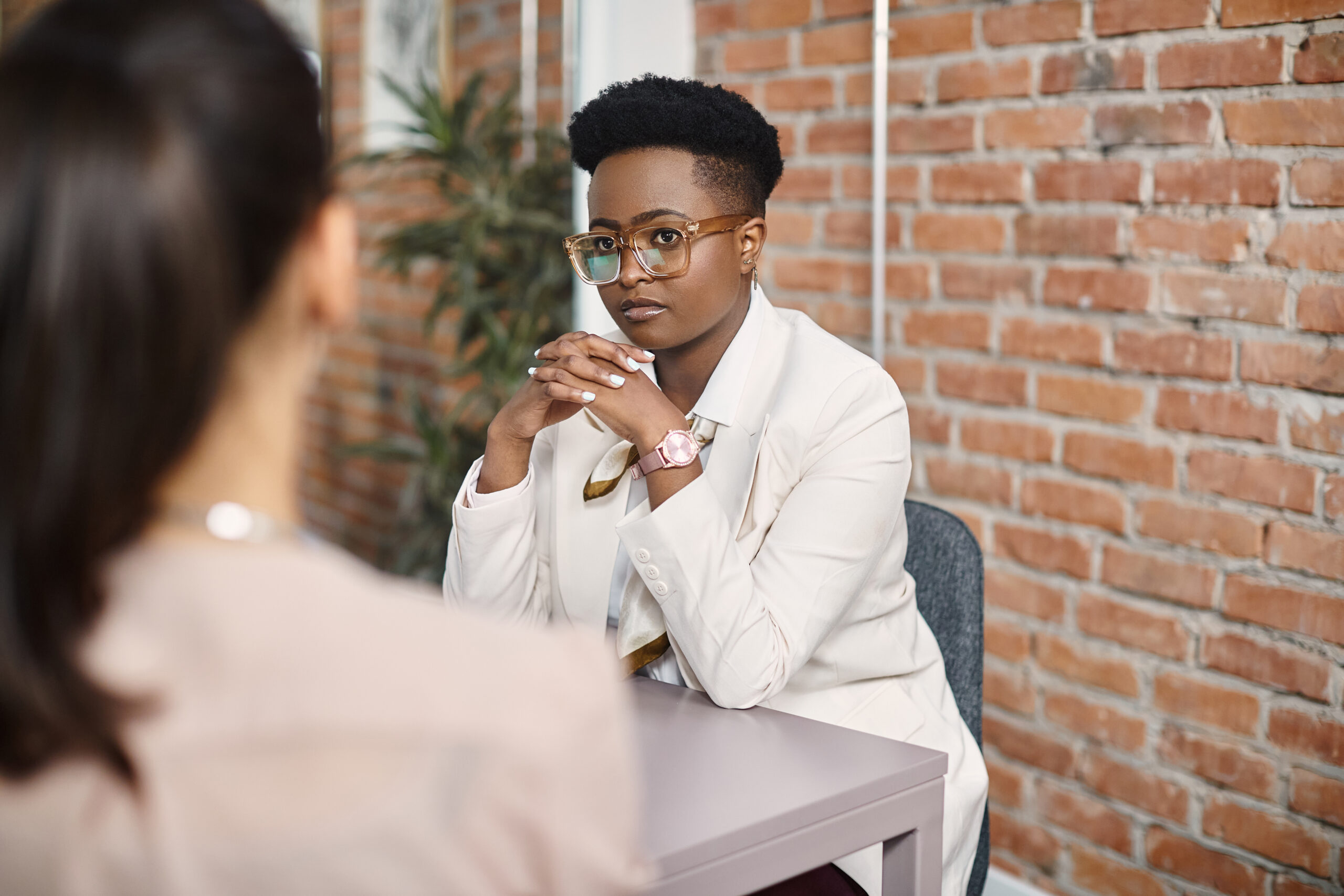 African American Ceo Talking To Her Colleague During Business Meeting In The Office.