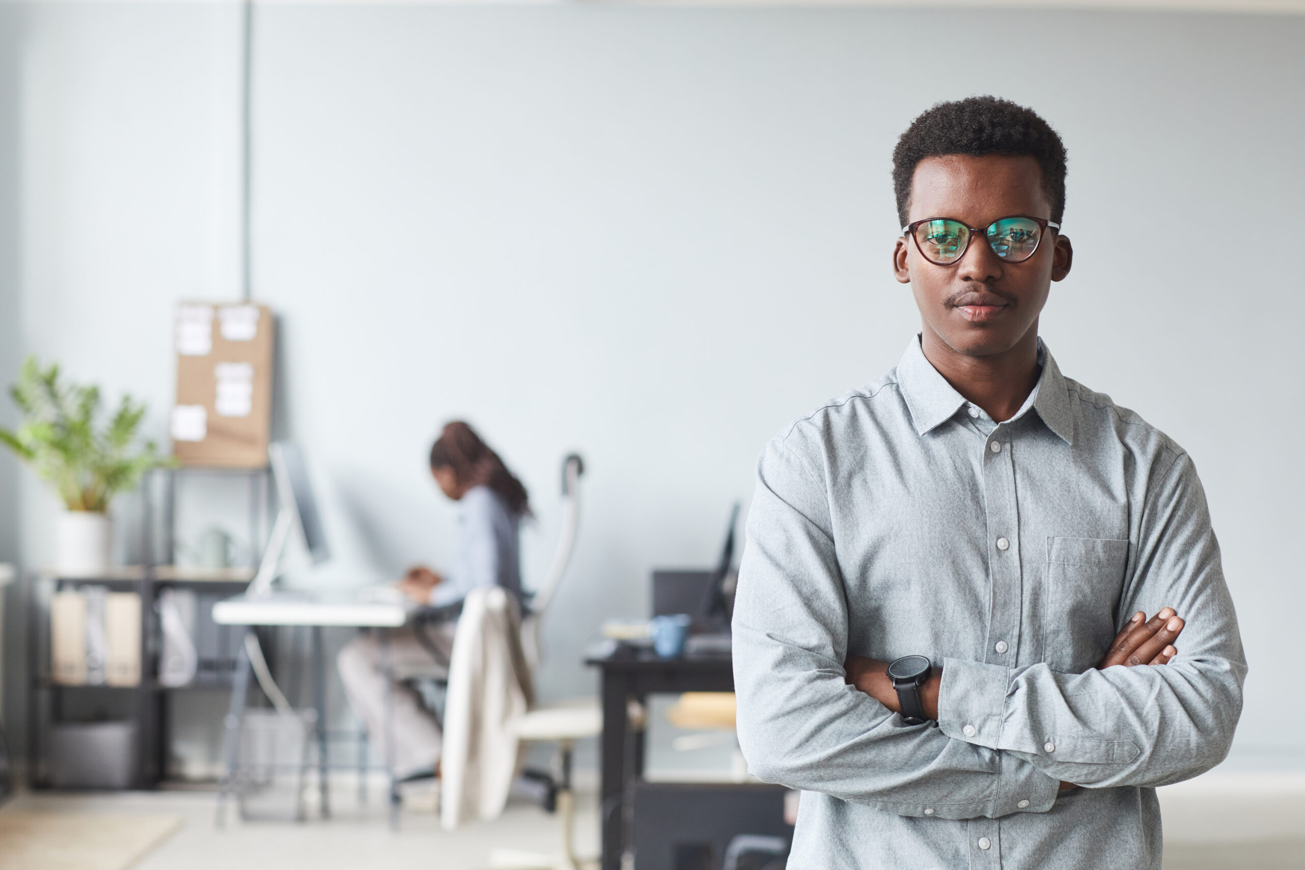 Portrait Of African American Man Standing In Office