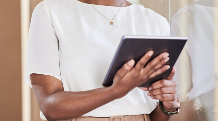 Shot of a young businesswoman using her digital tablet at work.