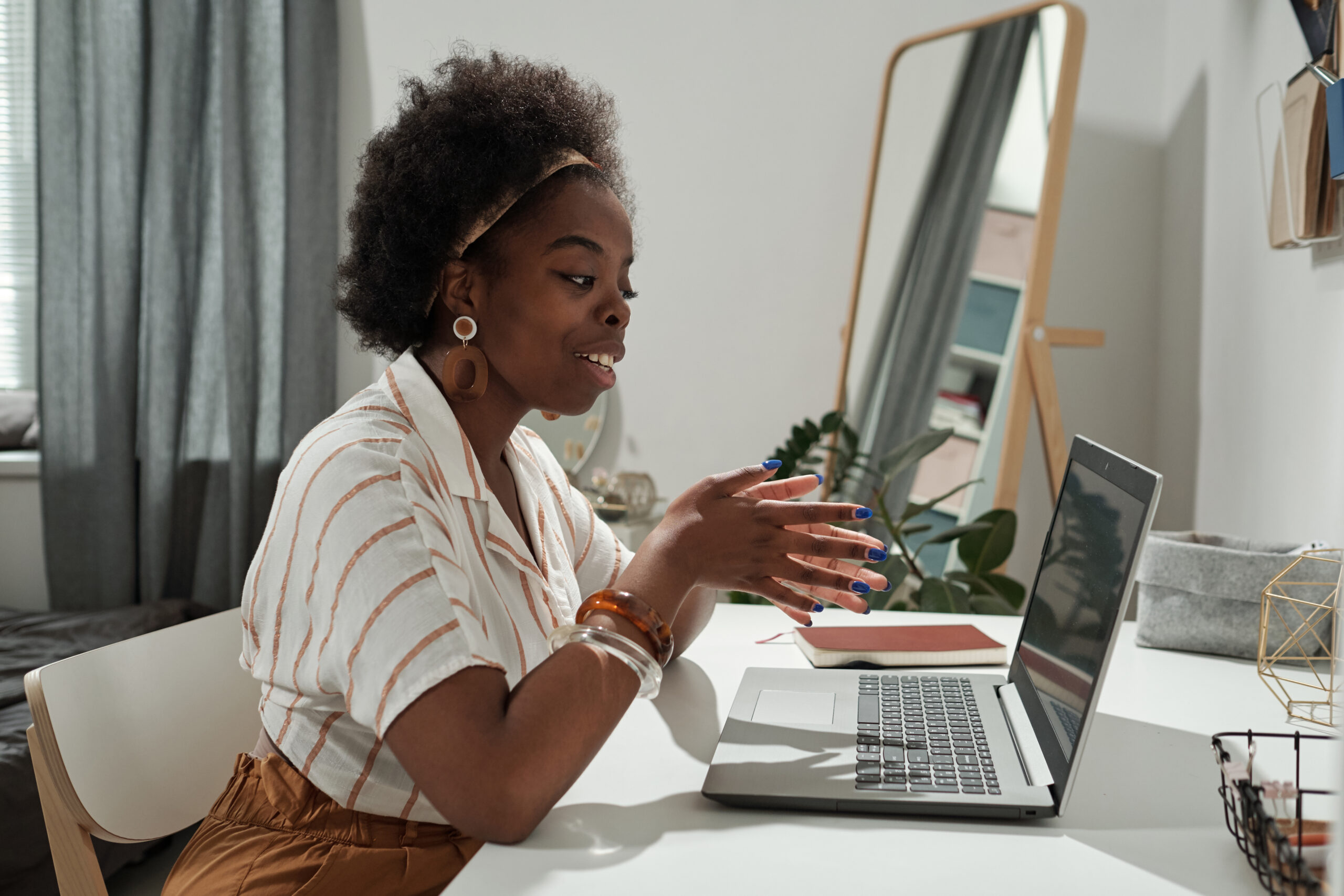 Young African Female Freelancer Communicating In Video Chat