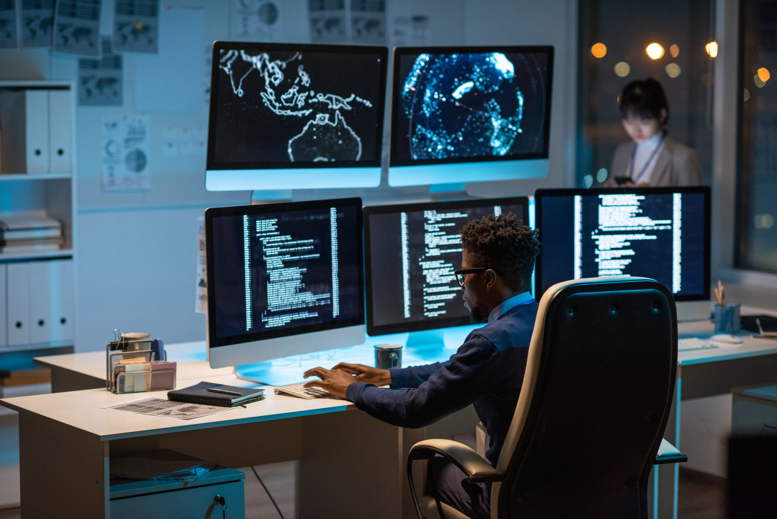 Young Contemporary Cyber Security Manager Typing In Front Of Computer