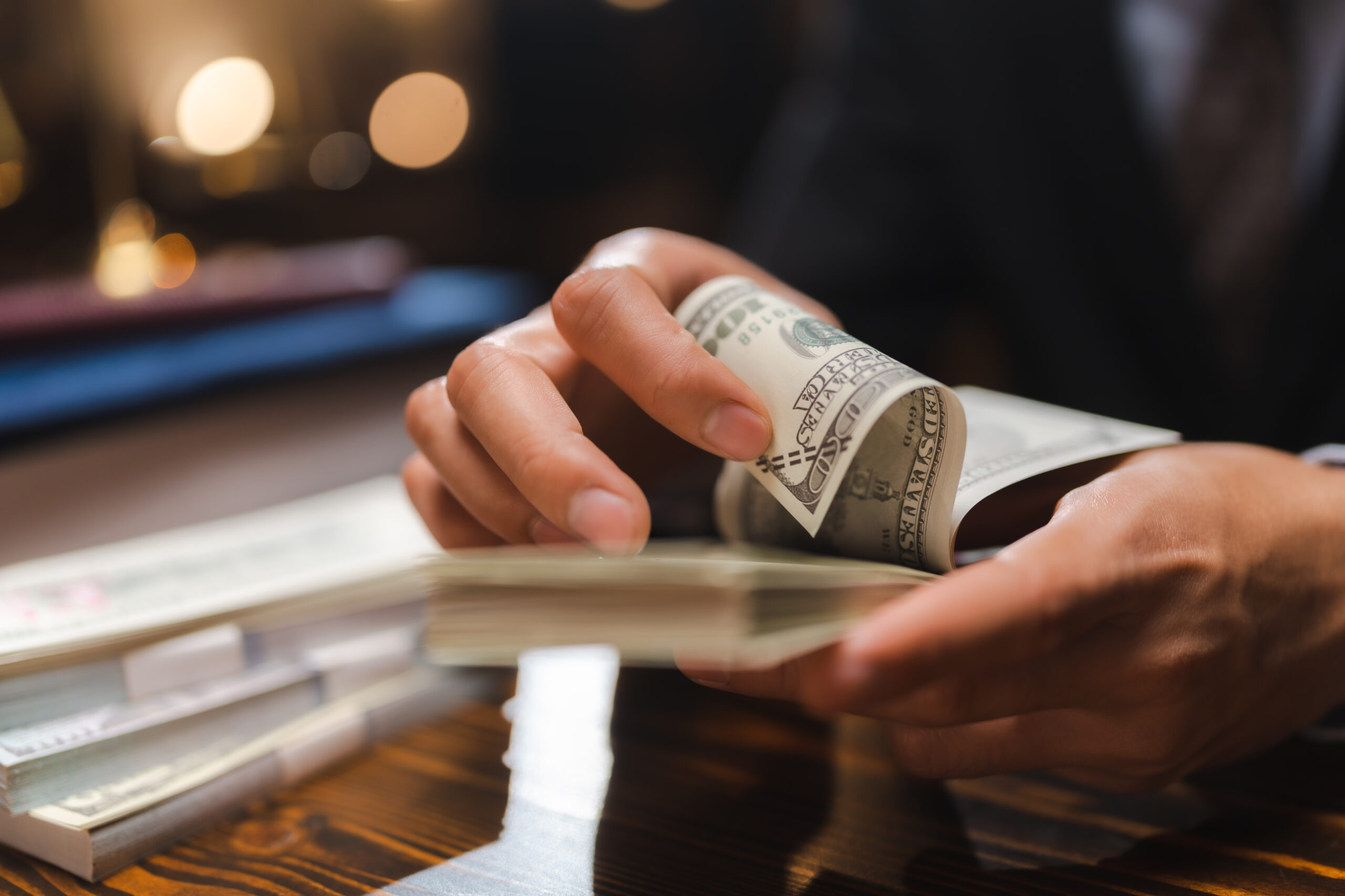 Business Hands Holding Dollar Bank, Bookkeeper Financial Inspector Checking A Money