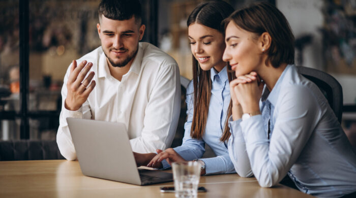 Group Of People Working Out Business Plan In An Office